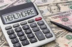 calculator-on-money-with-healthcare-written-on-it