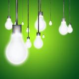 Multiple-glowing-light-bulbs-hanging-in-front-of-lime-green-background-e1498752529590