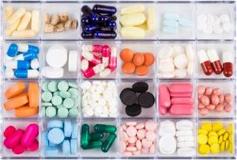 Various-pills-and-capsules-in-a-container-e1504731709180
