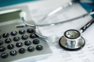 Calculator and Stethoscope on Medical Bill_ACCCBuzz
