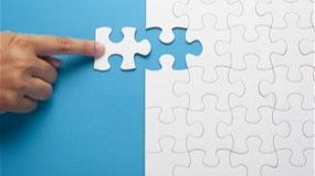 Hand moving in missing puzzle piece